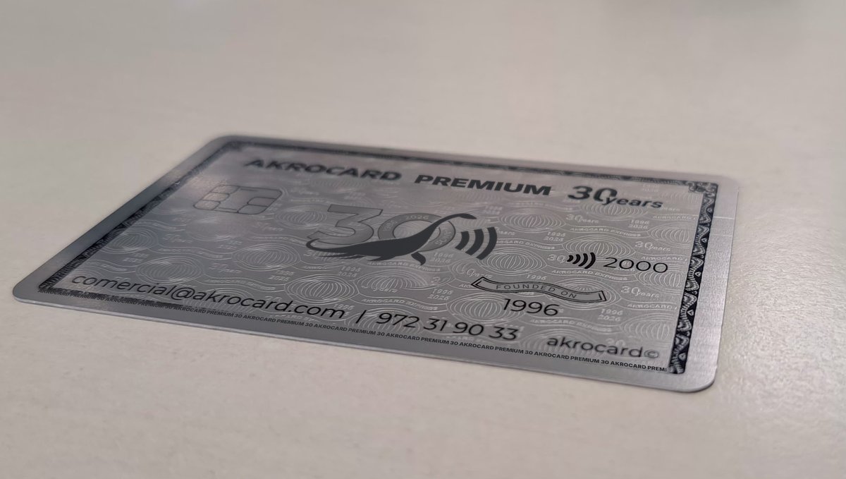 Silver Akrocard Premium metal card on a table, perspective view